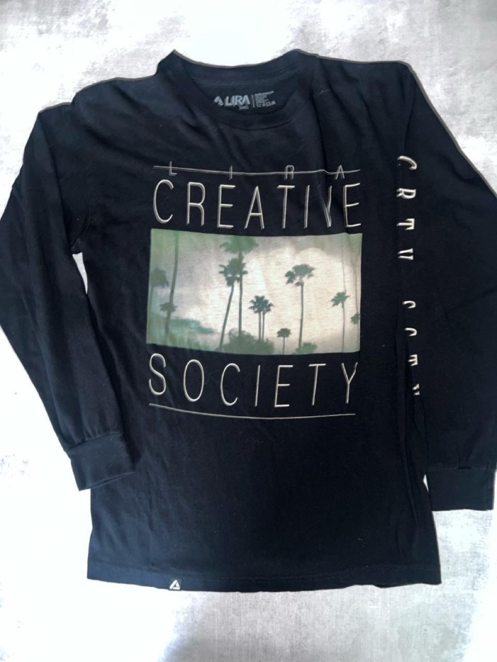 Lira Black Long Sleeve 'Creative Society' Graphic Tee with Palm Print